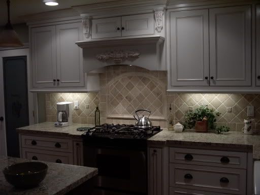 santa cecelia granite and white cabinets pics    Kitchens Forum