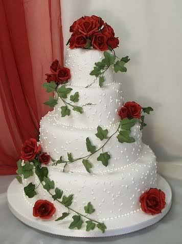gold wedding cake with red roses