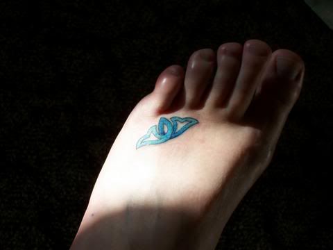 toe ring tattoos