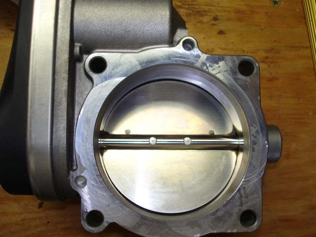Regarding the gap you're seeing between the throttle plate and the throttle body, I think it sounds normal. Here's a pic of mine after cleaning: